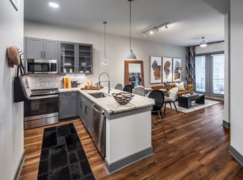 Aura thirty2 new apartments in austin, texas model kitchen